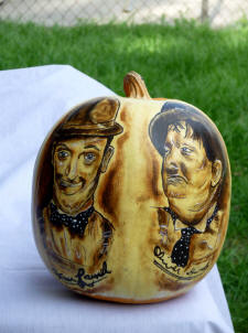 Laurel & Hardyheads painted on a pumpkin
